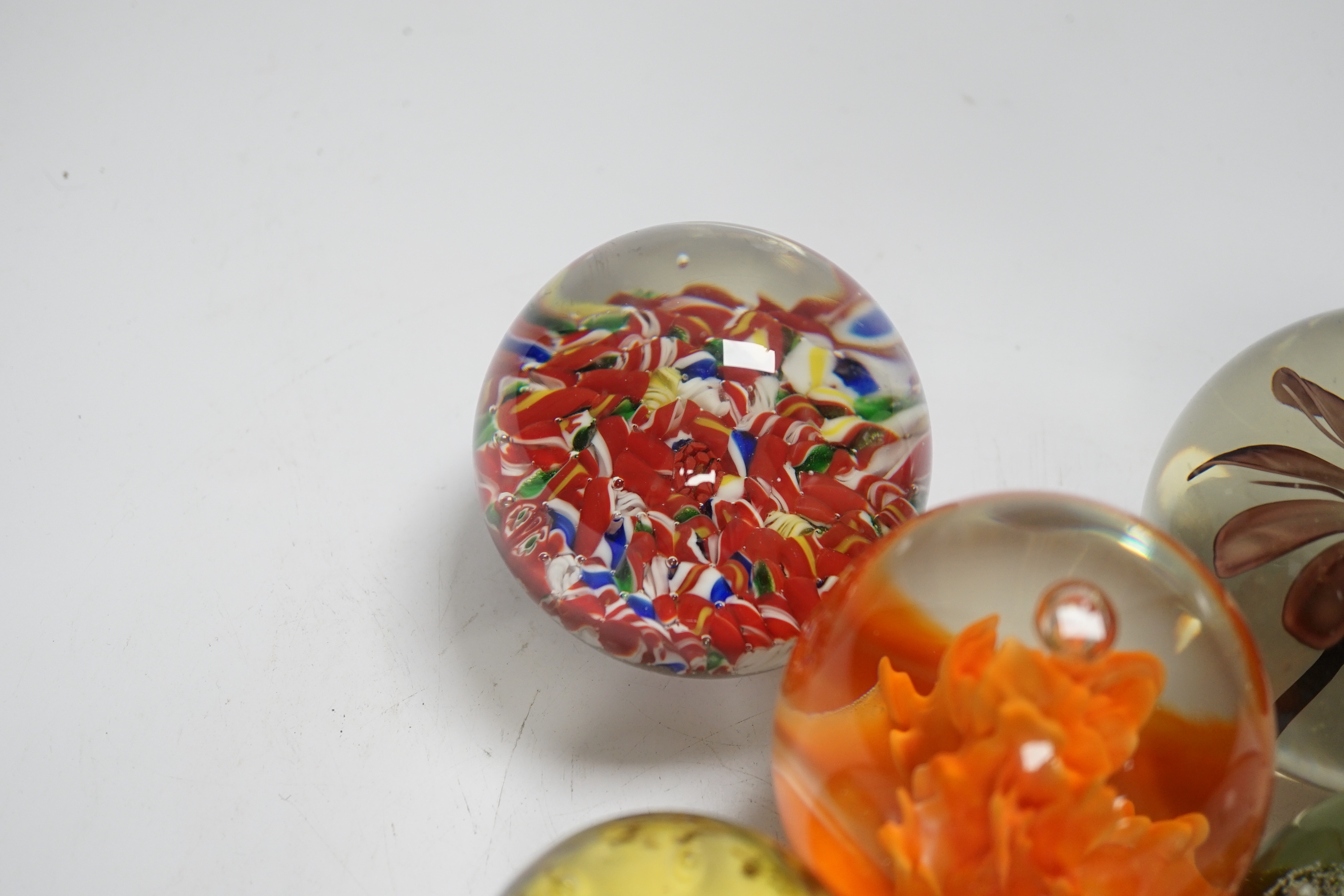 Eight Scottish or Chinese glass paperweights